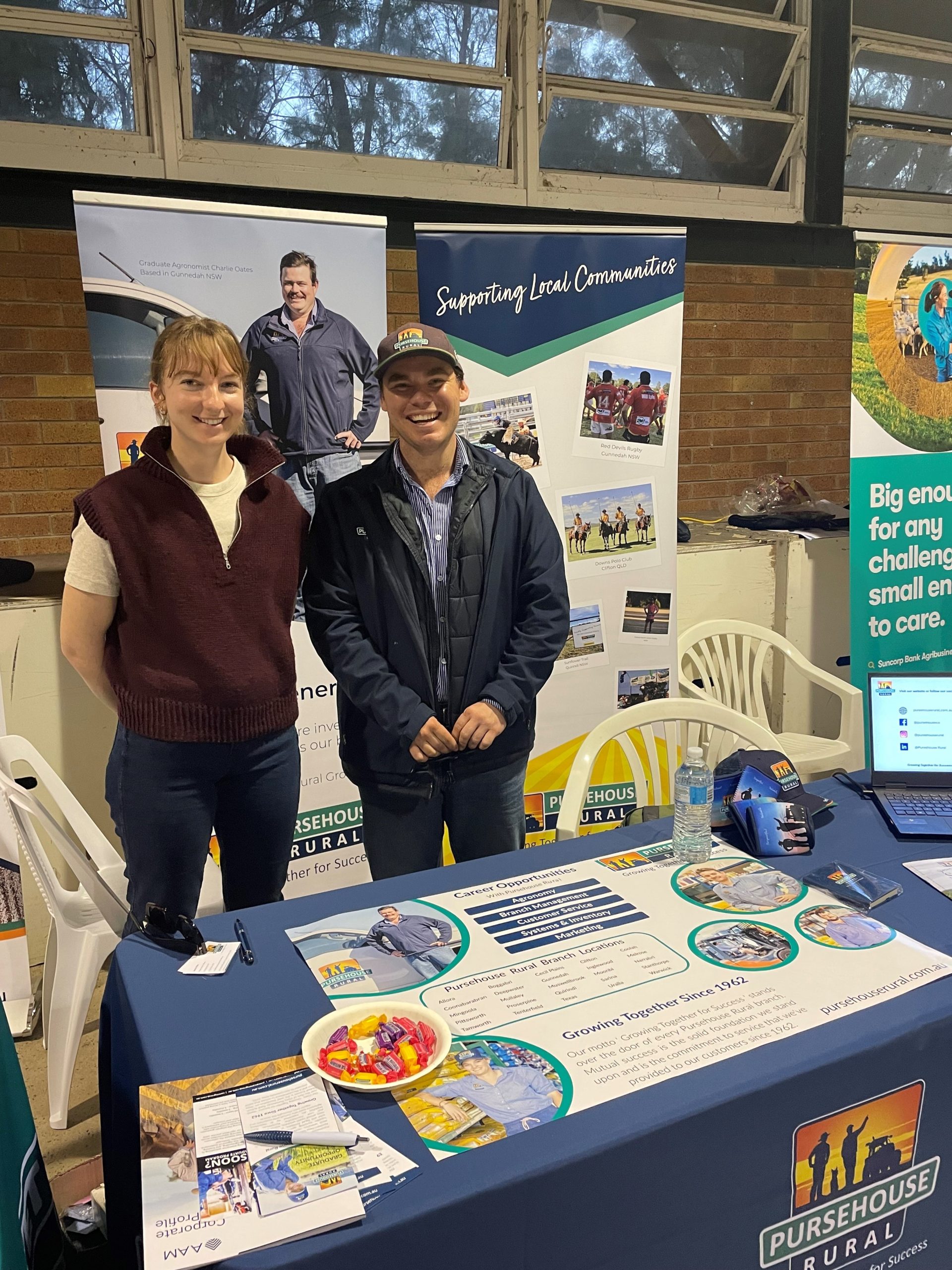 Pursehouse Rural employee with University Queensland student at Pursehouse Rural branded stand at agriculture event